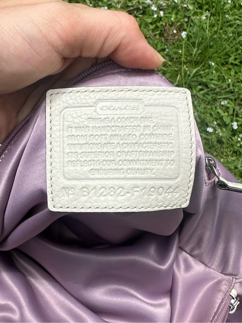 Coach Penelope pebbled leather purse in tan and cream w/ turn lock front pocket